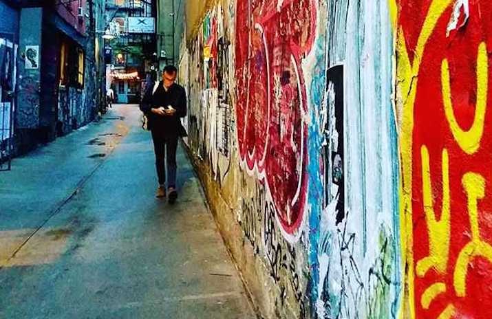 6 Essential Types of Insurance for Self-Employed Workers That People Often Forget 6 Essential Types of Insurance for Self-Employed Workers That People Often Forget | Photo of a man working on his phone as he walks down an alley with graffiti | Photo by Daye Deura