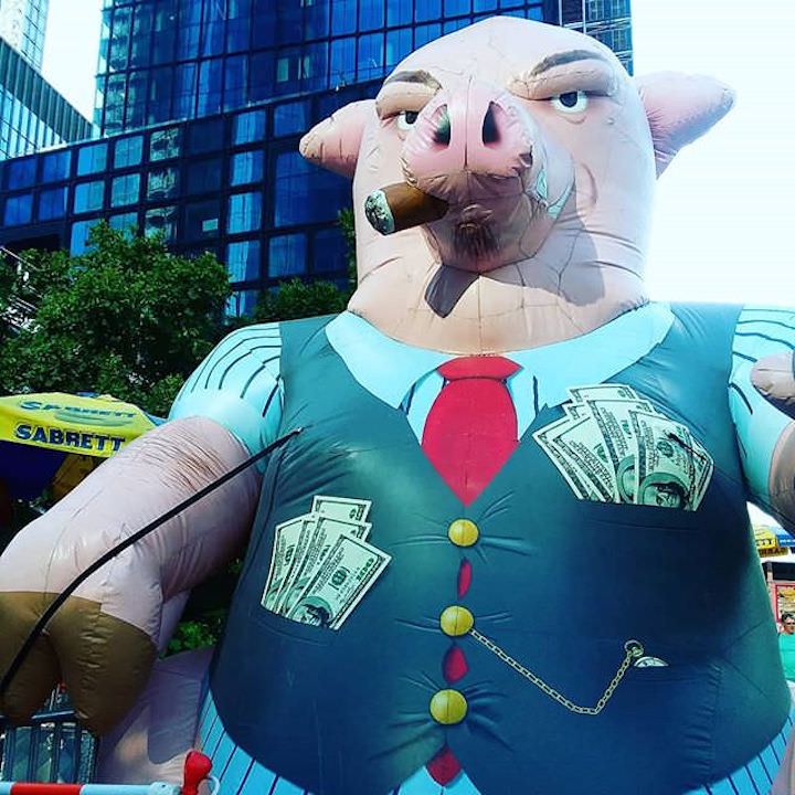 What is a fiduciary? | Fiduciary definition | Inflatable pig | Photo by Daye Deura