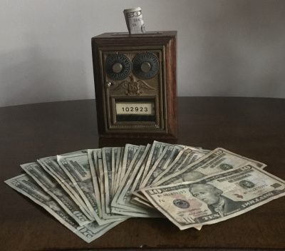 What is passive investing and how does it work? Active vs. passive investing | dollar bills on a table | Photo by Rita Pouppirt