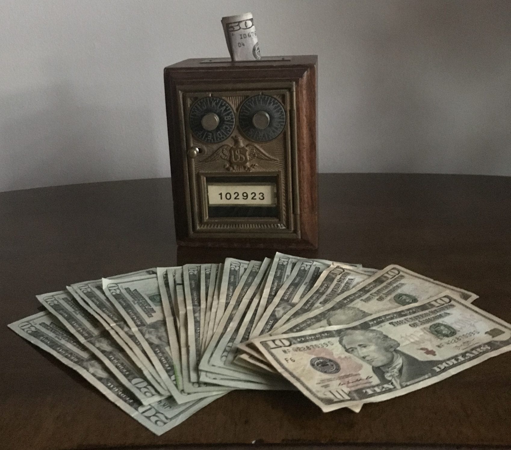 What is passive investing and how does it work? Active vs. passive investing | dollar bills on a table | Photo by Rita Pouppirt