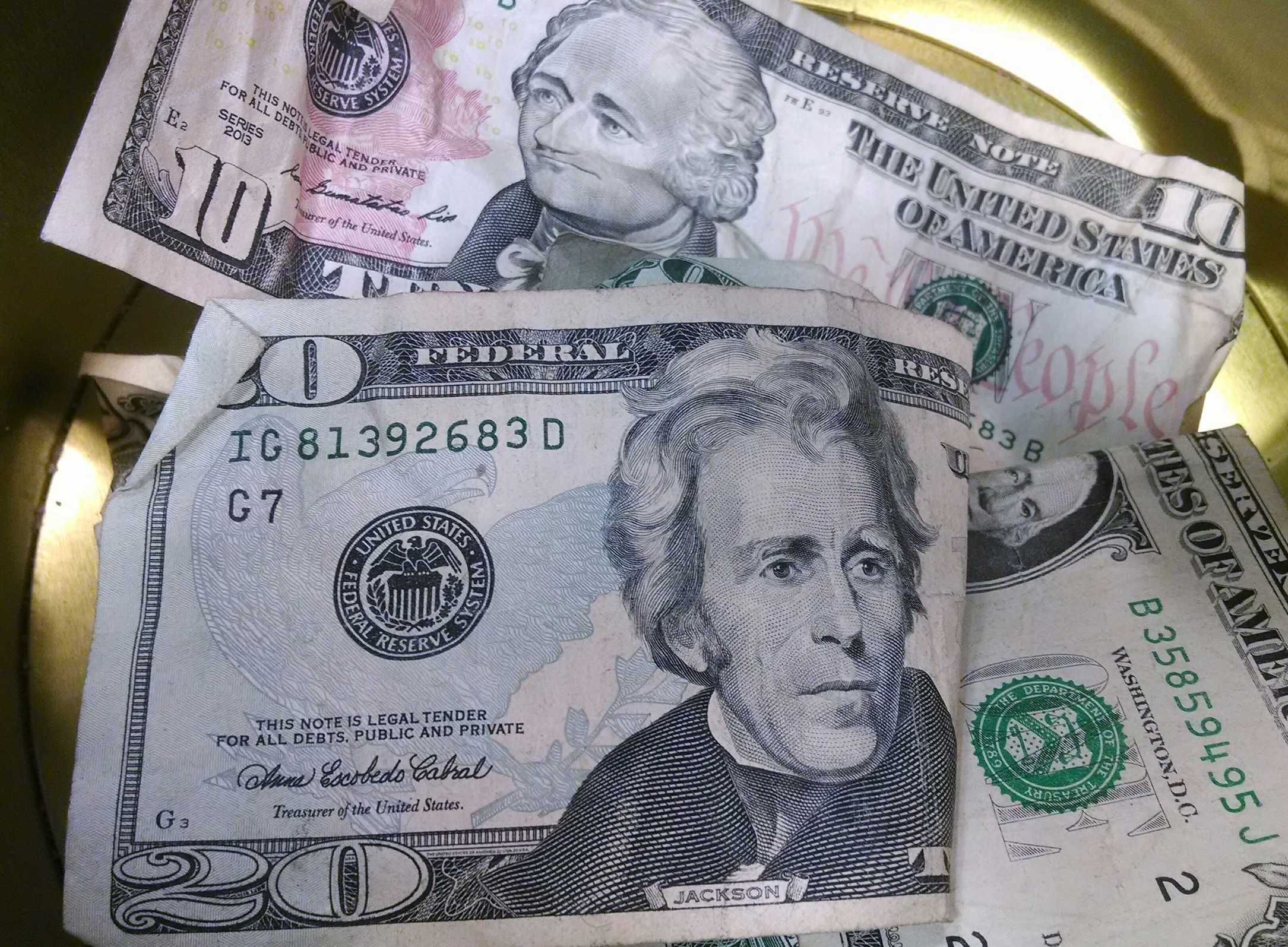 What is a 401(k)? How does a 401(k) work? | Photo of money ($20, $10, and single dollar bills) | Photo by Evan Sachs
