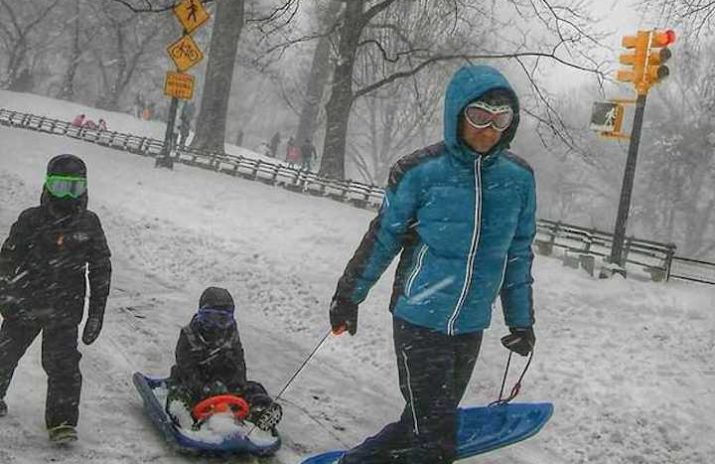 The Best Things in Life Are Free: 10 No-Cost Activities | Daye Deura The Best Things in Life Are Free: 10 Free Activities | Photo of a father and his children going sledding | Photo by Daye Deura