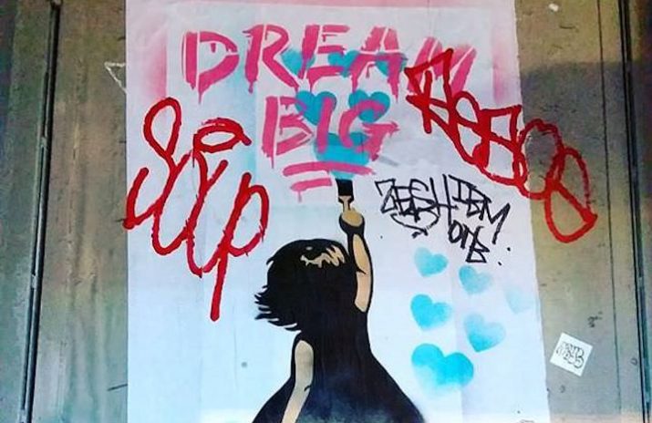 How to Stick to New Year's Resolutions and Meet Financial Goals How to Stick to New Year's Resolutions and Meet Financial Goals | Graffiti of a girl painting the words